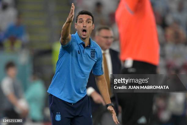 Argentina's coach Lionel Scaloni shouts instructions to his players from the touchline during the Qatar 2022 World Cup Group C football match between...
