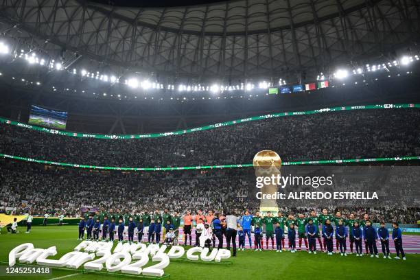 Saudi Arabia's and Mexico's teams line up for their national anthems ahead of the Qatar 2022 World Cup Group C football match between Saudi Arabia...
