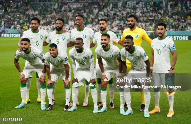 Saudi Arabia players, back row, left to right, Ali Al-Bulaihi, Firas Al-Buraikan, Mohamed Kanno, Ali Al-Hassan, Mohammed Al-Owais, Salem Al-Dawsari,...