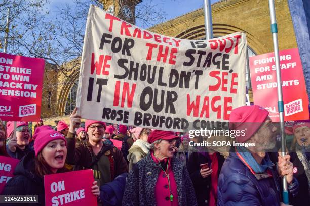 Protesters hold a Rose Bruford College drama school banner during the rally. Thousands of people gathered outside King's Cross Station for a rally in...