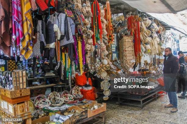 People shop at an antiques market in the occupied West Bank city of Bethlehem.