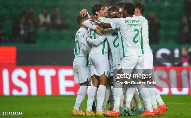Paulinho of Sporting CP celebrates with teammates after scoring a goal during the Liga Bwin match between Sporting CP and SC Farense at Estadio Jose...