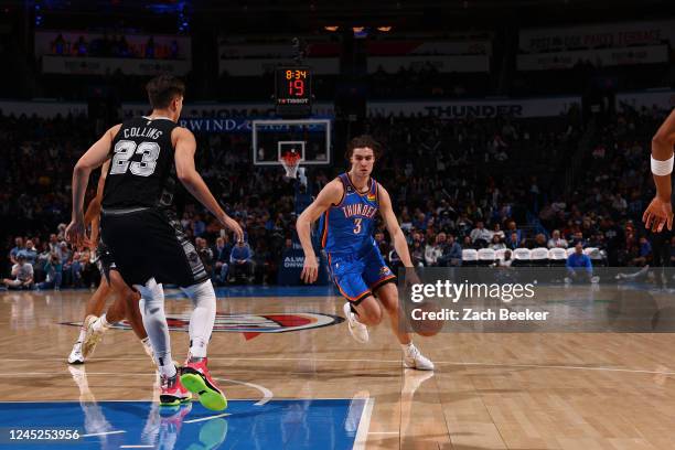 Josh Giddey of the Oklahoma City Thunder dribbles the ball during the game against the San Antonio Spurs on November 30, 2022 at Paycom Arena in...
