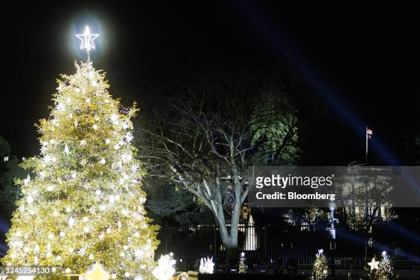 The National Christmas Tree with the White House in the background during the 100th National Christmas Tree Lighting Ceremony in Washington, DC, US,...