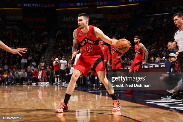 Juancho Hernangomez of the Toronto Raptors dribbles the ball during the game against the New Orleans Pelicans on November 30, 2022 at the Smoothie...