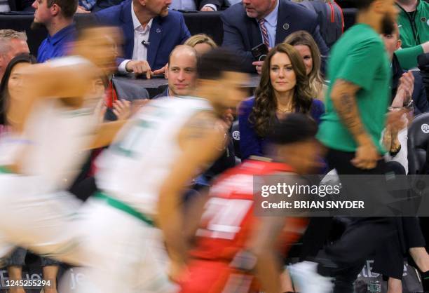 Britain's Prince William, and Catherine, Princess of Wales watch the National Basketball Association game between the Boston Celtics and the Miami...