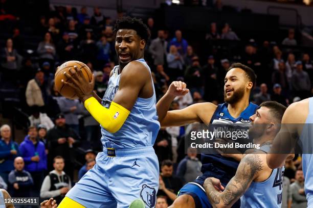Jaren Jackson Jr. #13 of the Memphis Grizzlies rebounds the ball against the Minnesota Timberwolves in the first quarter of the game at Target Center...