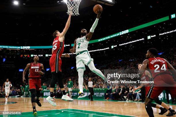 Jaylen Brown of the Boston Celtics goes to the basket against Duncan Robinson of the Miami Heat during the second half at TD Garden on November 30,...