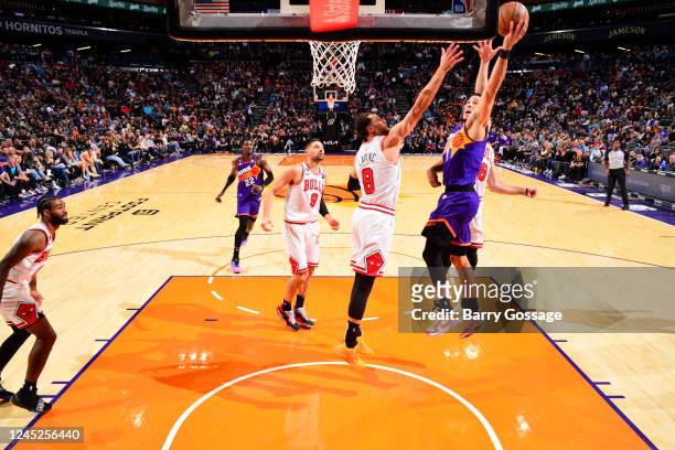 Devin Booker of the Phoenix Suns drives to the basket during the game against the Chicago Bulls on November 30, 2022 at Footprint Center in Phoenix,...