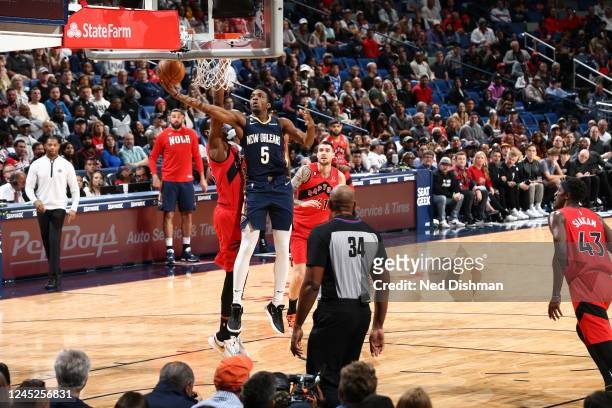 Herbert Jones of the New Orleans Pelicans drives to the basket during the game against the Toronto Raptors on November 30, 2022 at the Smoothie King...