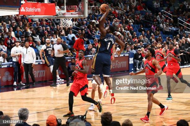 Zion Williamson of the New Orleans Pelicans drives to the basket during the game against the Toronto Raptors on November 30, 2022 at the Smoothie...