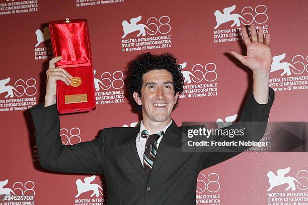 Cinematographer Robbie Ryan of "Wuthering Heights" poses with the Best Cinematography Award during the Award Winners Photocall during the 68th Venice...