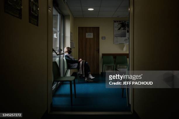 In this photograph taken on November 24, 2022 a patient waits in the Pontgibaud health house waiting room, central France. - Midwives,...