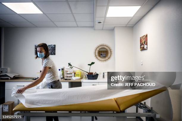 In this photograph taken on November 24, 2022 a doctor prepares her office at the Pontgibaud health house, central France. - Midwives,...