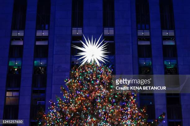 The Rockefeller Center Christmas tree is seen illuminated during the Christmas Tree Lighting ceremony at the Rockefeller Plaza on November 30, 2022...