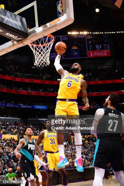 LeBron James of the Los Angeles Lakers dunks the ball during the game against the Portland Trail Blazers on November 30, 2022 at Crypto.Com Arena in...