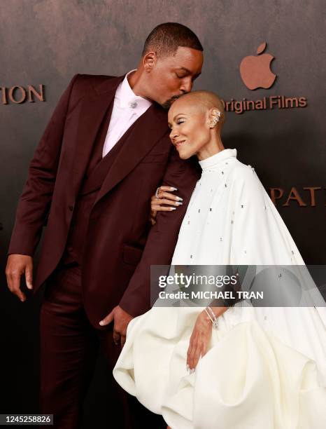 Actor Will Smith and his wife actress Jada Pinkett Smith arrive for the premiere of Apple Original Films' "Emancipation" at the Regency Village...