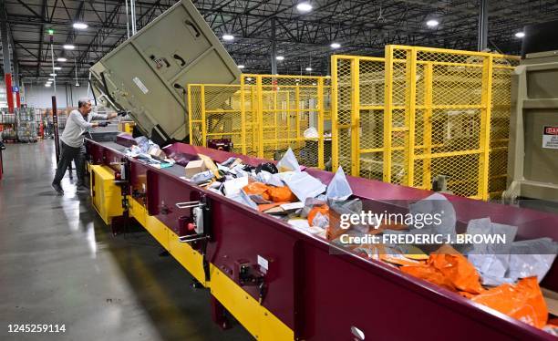 Postal Service employee sorts mail at the Los Angeles Processing and Distribution Center in preparation for another busy holiday season, November 30...