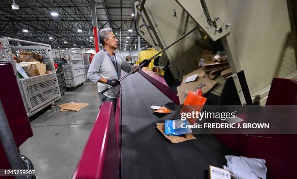 Postal Service employee sorts mail at the Los Angeles Processing and Distribution Center in preparation for another busy holiday season, November 30...