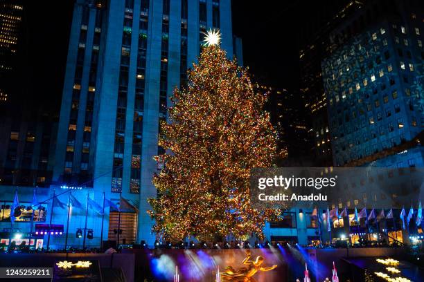Rocketfeller Center Christmas tree is illuminated during the 90th Annual Rockefeller Center Christmas Tree Lighting Ceremony in New York City, United...
