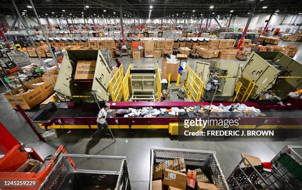 Postal Service employee sorts mail at the Los Angeles Processing and Distribution Center in preparation for another busy holiday season, November 30...