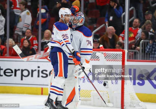 Edmonton Oilers defenseman Darnell Nurse greets Edmonton Oilers goaltender Stuart Skinner after a game between the Edmonton Oilers and the Chicago...