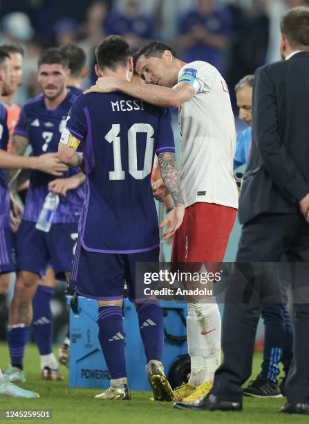 Robert Lewandowski of Poland greets Cristian Romero of Argentina during the FIFA World Cup Qatar 2022 Group C match between Poland and Argentina at...