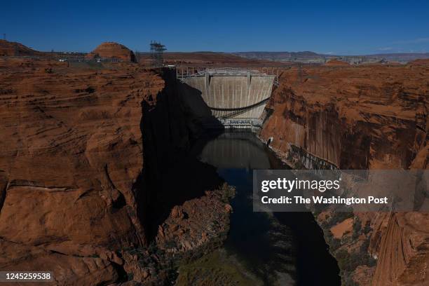 The Colorado River and the Glen Canyon Dam is seen from the Glen Canyon Dam Overlook on October 23, 2022 in Page, Arizona. The water in Lake Powell...