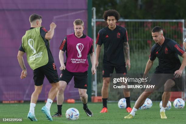 Belgium's Kevin De Bruyne, Belgium's Axel Witsel and Belgium's Leander Dendoncker fight for the ball during a training session of the Belgian...