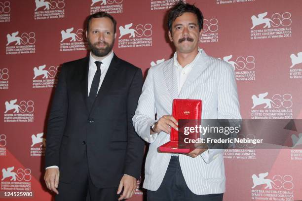 Filmmaker Yorgos Lanthimos and writer Efthymis Filippou of "Alps" pose with the Best Screenplay Award during the Award Winners Photocall during the...