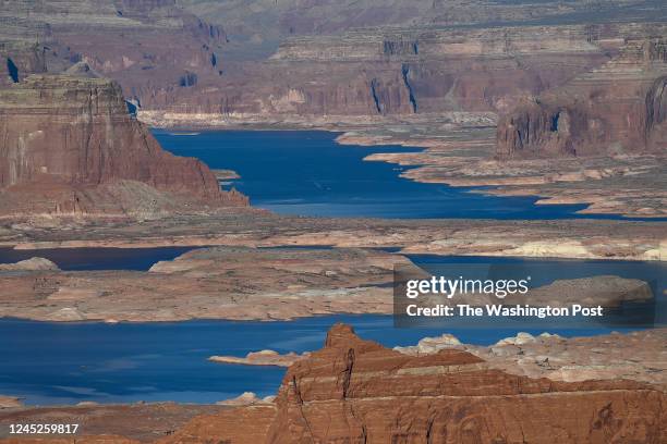 Water from Padre Bay in Utah on flows between a mesa October 23 which is seen from Page, Arizona. Padre Bay connects with Lake Powell and Lake Powell...