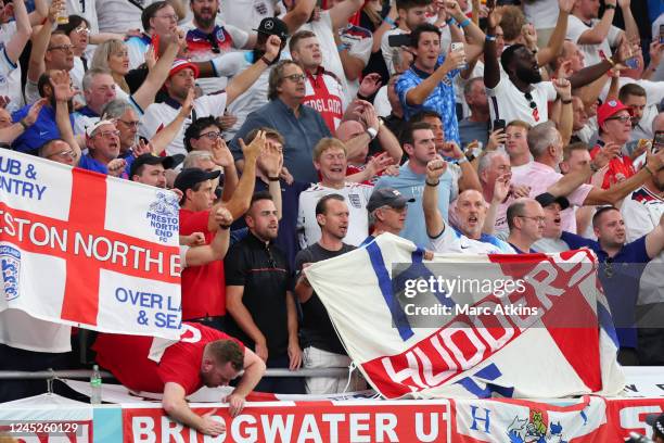 England fans display banners during the FIFA World Cup Qatar 2022 Group B match between Wales and England at Ahmad Bin Ali Stadium on November 29,...