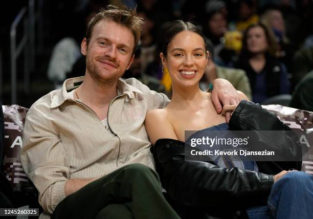 Singer Finneas and Claudia Sulewski attend a basketball game between the Los Angeles Lakers and Portland Trail Blazerat Crypto.com Arena on November...