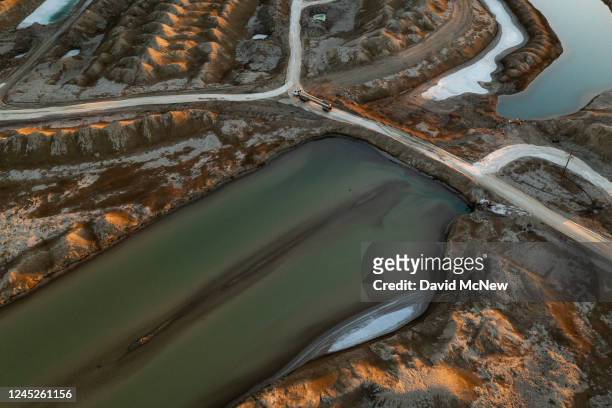 In an aerial view, a truck is driven between salt evaporation ponds on Bristol Dry Lake where Standard Lithium Ltd. Is preparing to use Direct...
