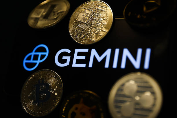 Gemini logo displayed on a phone screen and representation of cryptocurrencies are seen in this illustration photo taken in Krakow, Poland on...