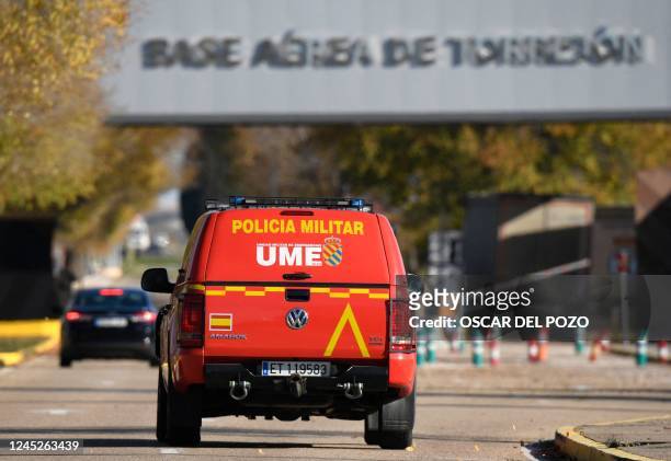 Military police car patrols at the main entrance of the Spanish air force base, in Torrejon de Ardoz near Madrid, on December 1 after Spain's...