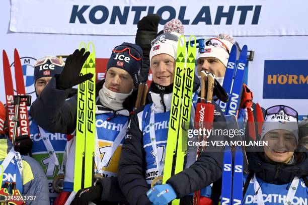 Norway's team Sturla Holm Laegreid , Tarjei Boe, Johannes Thingnes Boe and Vetle Sjaastad Christiansen celebrate on the podium after the men's...