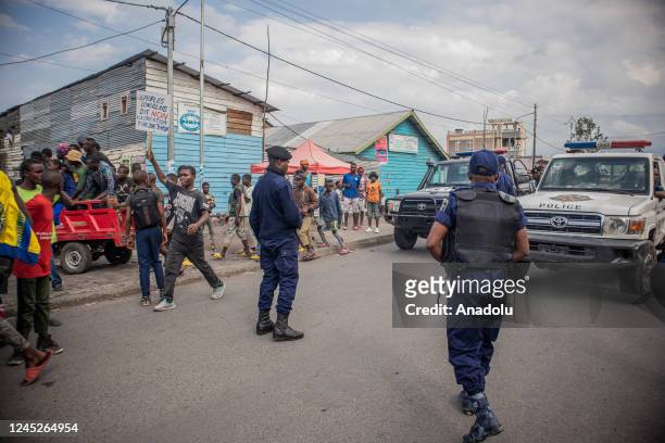 Police officers stand guard during a demonstration to draw attention to the danger of separation of the country in Goma, Democratic Republic of the...