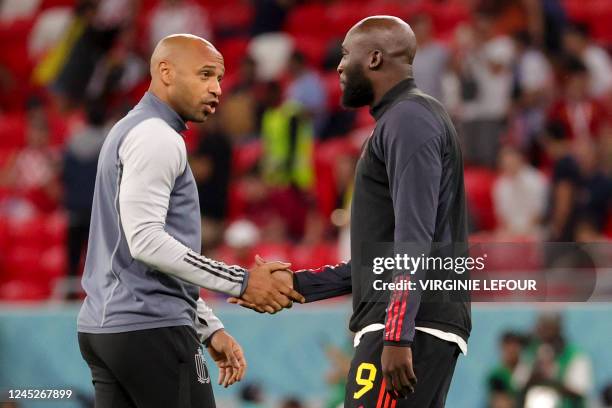 Belgium's assistant coach Thierry Henry and Belgium's Romelu Lukaku pictured at the warm up on the field ahead of a soccer game between Belgium's...