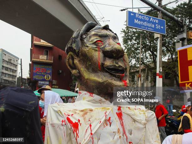 An effigy of President Ferdinand "Bongbong" Marcos Jr. Held by protesters at Mendiola, Manila. Militant labor groups unite & stage a program in...