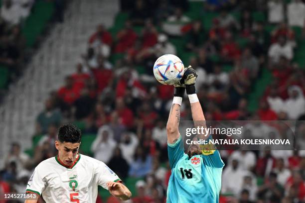 Canada's goalkeeper Milan Borjan deflects a shot during the Qatar 2022 World Cup Group F football match between Canada and Morocco at the Al-Thumama...