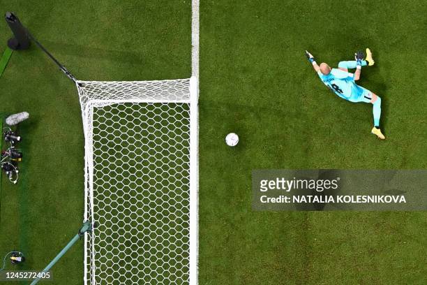 Morocco's forward Youssef En-Nesyri scores his team's second goal past Canada's goalkeeper Milan Borjan during the Qatar 2022 World Cup Group F...