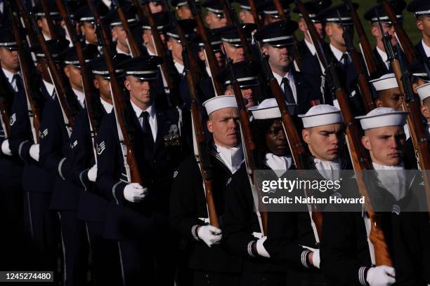 Members of the National Honor Guard march past US President Joe Biden and French President Emmanuel Macron during an official state visit arrival...