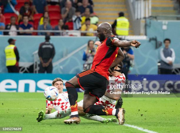 Romelu Lukaku of Belgium is prevented from having a shot at goal by the tackle from Josko Gvardiol of Croatia during the FIFA World Cup Qatar 2022...