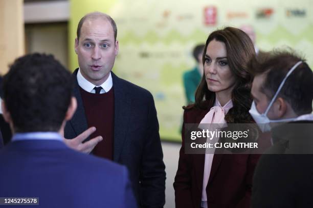 Britain's Prince William and Catherine, Princess of Wales speak with startup companies that work at Greentown Labs as they tour the location for a...