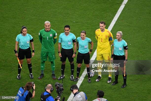 French referee Stephanie Frappart , the first woman referee to take charge of a menâs World Cup match, and assistants Neuza Back from Brazil and...