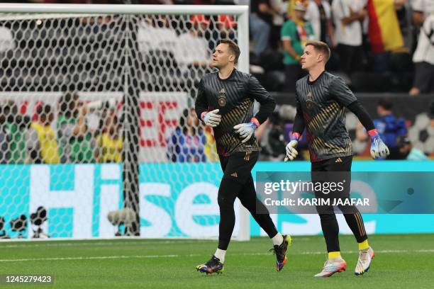 Germany's goalkeeper Manuel Neuer and Germany's goalkeeper Marc-Andre Ter Stegen warm up before the Qatar 2022 World Cup Group E football match...