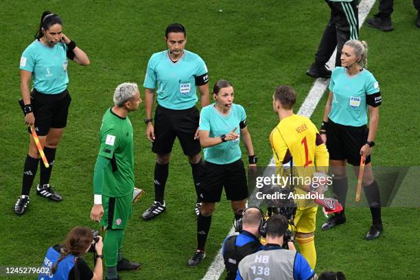 French referee Stephanie Frappart , the first woman referee to take charge of a menâs World Cup match, and assistants Neuza Back from Brazil and...