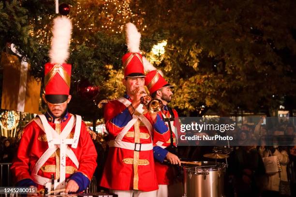 Band is playing the 'Feliz Navidad' during the first day of illuminating the 21 meters Christmas tree of Athens, Greece at Syntagma square on...