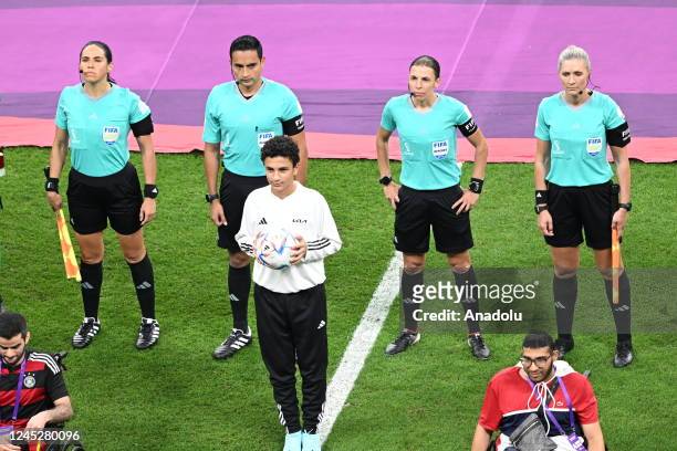 French referee Stephanie Frappart , the first woman referee to take charge of a menâs World Cup match, and assistants Neuza Back from Brazil and...